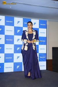 actress Vidya Balan in a blue dress at an event
