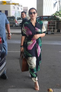 actress vidya balan in a colorful dress at the airport
