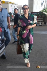actress vidya balan in a colorful dress at the airport
