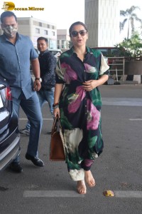 actress vidya balan in a colorful dress at the airport