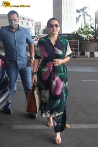 actress vidya balan in a colorful dress at the airport