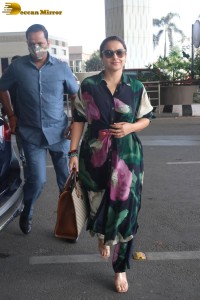 actress vidya balan in a colorful dress at the airport