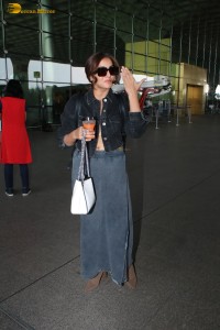 actress Wamiqa Gabbi chic look in a denim skirt at airport