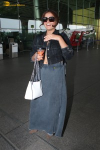 actress Wamiqa Gabbi chic look in a denim skirt at airport