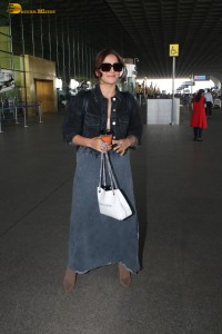 actress Wamiqa Gabbi chic look in a denim skirt at airport