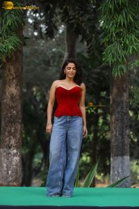 bollywood actress wamiqa gabbi chic look in a red top and denim jeans