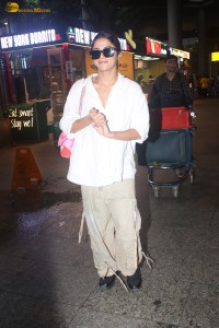 actress Wamiqa Gabbi in a white shirt and matching trousers looking stylish