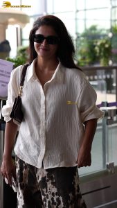 actress wamiqa gabbi chic look in white shirt and sunglasses at airport