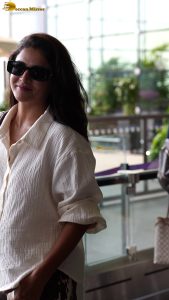 actress wamiqa gabbi chic look in white shirt and sunglasses at airport