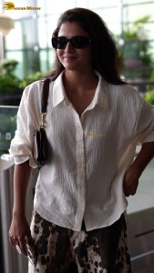actress wamiqa gabbi chic look in white shirt and sunglasses at airport