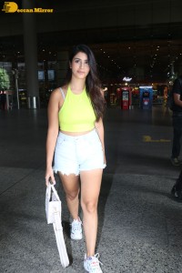 Actress Warina Hussain seen in a green top and denim shorts