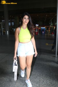 Actress Warina Hussain seen in a green top and denim shorts