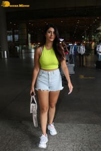 Actress Warina Hussain seen in a green top and denim shorts