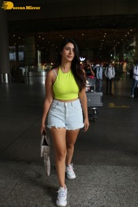 Actress Warina Hussain seen in a green top and denim shorts
