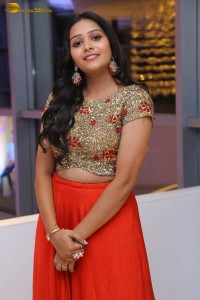 actress yamini bandaru photoshoot in a red skirt and matching top