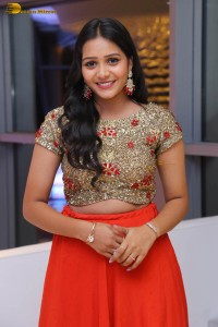 actress yamini bandaru photoshoot in a red skirt and matching top