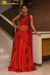Actress Yamini Bhaskar photoshoot in a red saree