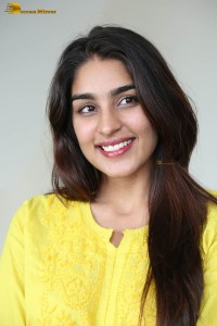 actress yukti thareja cute in a white kurti and torn black jeans