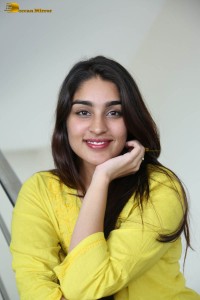 actress yukti thareja cute in a white kurti and torn black jeans