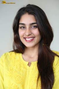 actress yukti thareja cute in a white kurti and torn black jeans