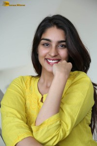 actress yukti thareja cute in a white kurti and torn black jeans