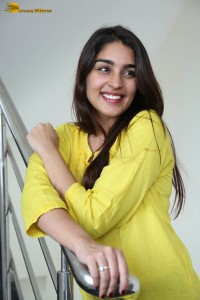 actress yukti thareja cute in a white kurti and torn black jeans