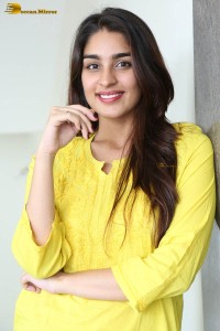 actress yukti thareja cute in a white kurti and torn black jeans