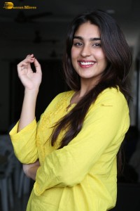 actress yukti thareja cute in a white kurti and torn black jeans