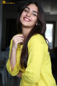 actress yukti thareja cute in a white kurti and torn black jeans