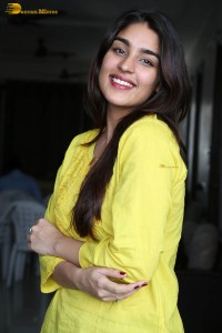 actress yukti thareja cute in a white kurti and torn black jeans