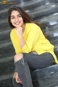 actress yukti thareja cute in a white kurti and torn black jeans