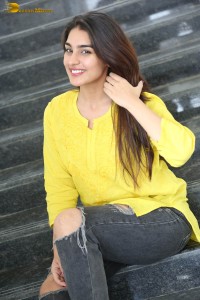 actress yukti thareja cute in a white kurti and torn black jeans