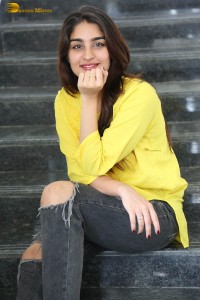 actress yukti thareja cute in a white kurti and torn black jeans