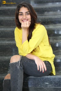 actress yukti thareja cute in a white kurti and torn black jeans