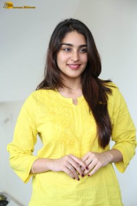 actress yukti thareja cute in a white kurti and torn black jeans