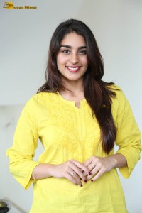 actress yukti thareja cute in a white kurti and torn black jeans