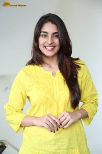 actress yukti thareja cute in a white kurti and torn black jeans