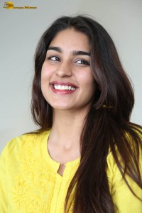 actress yukti thareja cute in a white kurti and torn black jeans