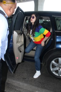 actress Zareen Khan in a colorful t-shirt and jeans at mumbai airport