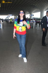actress Zareen Khan in a colorful t-shirt and jeans at mumbai airport