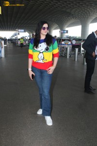 actress Zareen Khan in a colorful t-shirt and jeans at mumbai airport