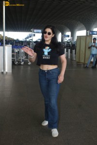 actress Zareen Khan in a short t-shirt and jeans